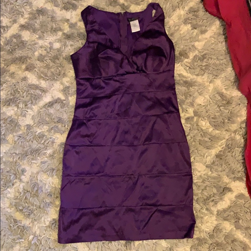 purple form fitting dress